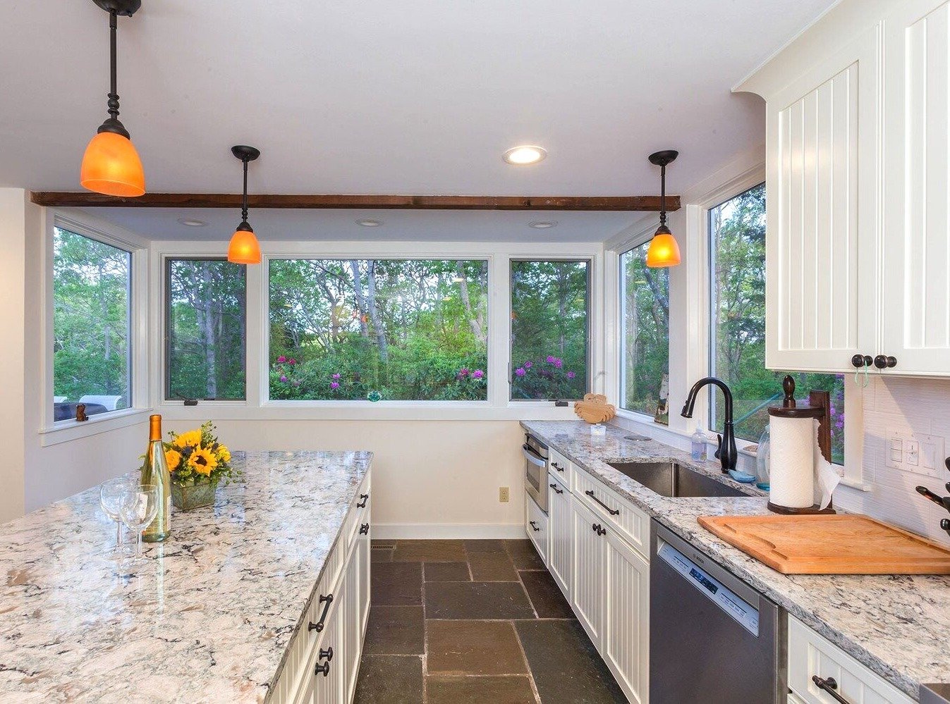 Renovated kitchen in North Falmouth featuring large windows and a spacious island