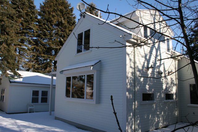 A 2 story addition we designed and seamlessly tied into the back of a ranch.