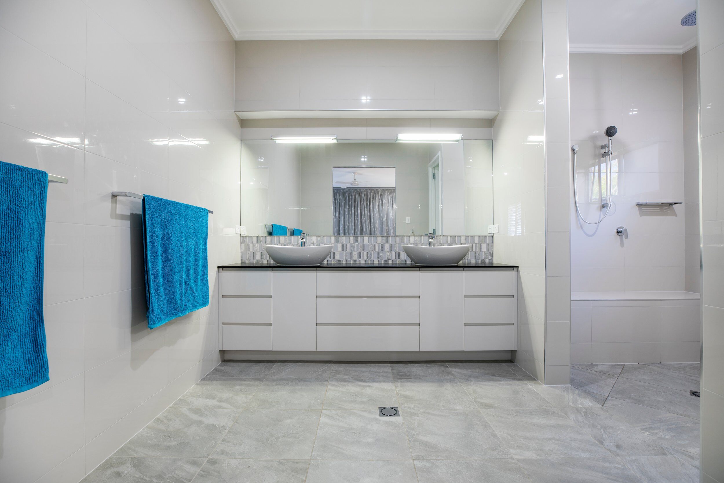 Clean and shiny new apartment bathroom remodel.