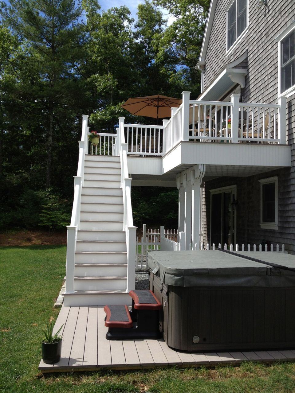 Azek white railing on back of house.
