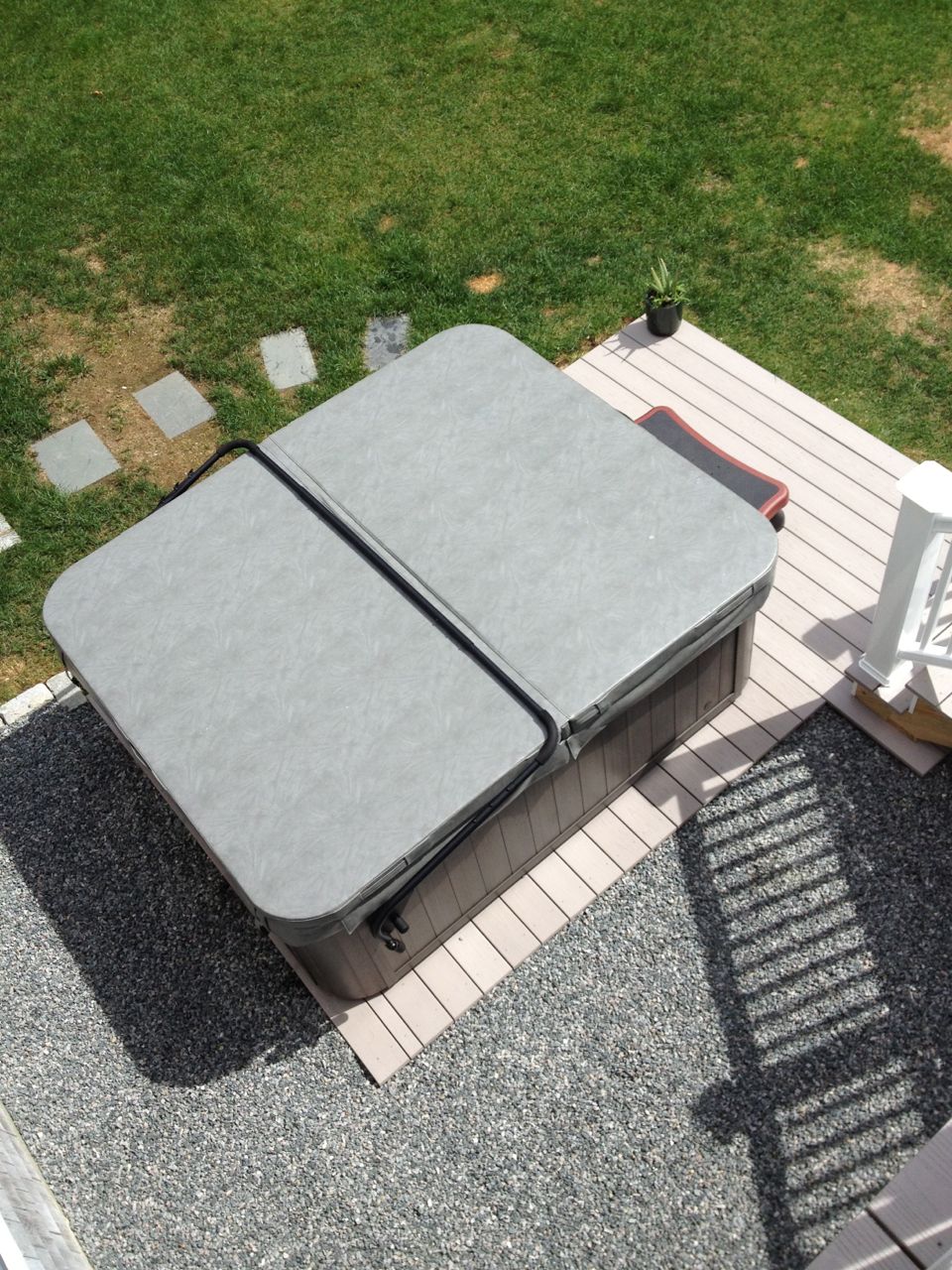 Hot tub on top of white deck