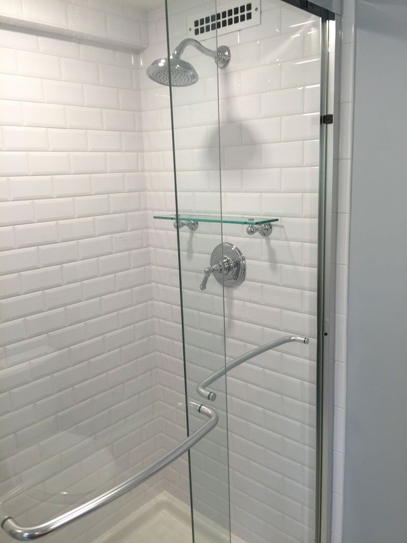 White subway tiles in beautiful shower