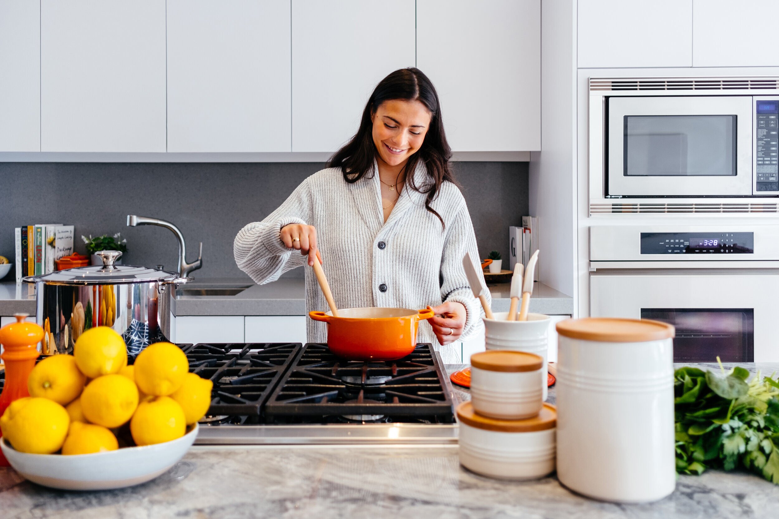 Woman cooking in beautiful modern kitchen