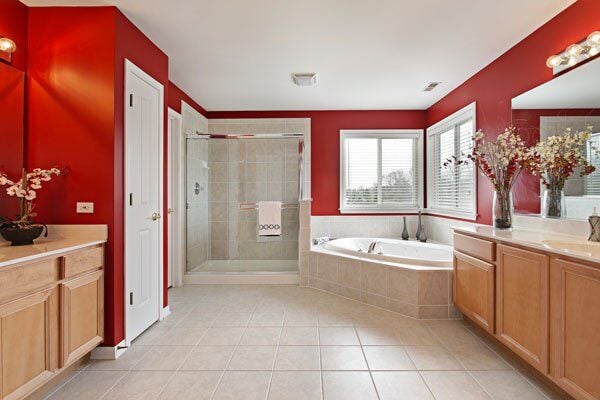 Spacious bathroom with red walls