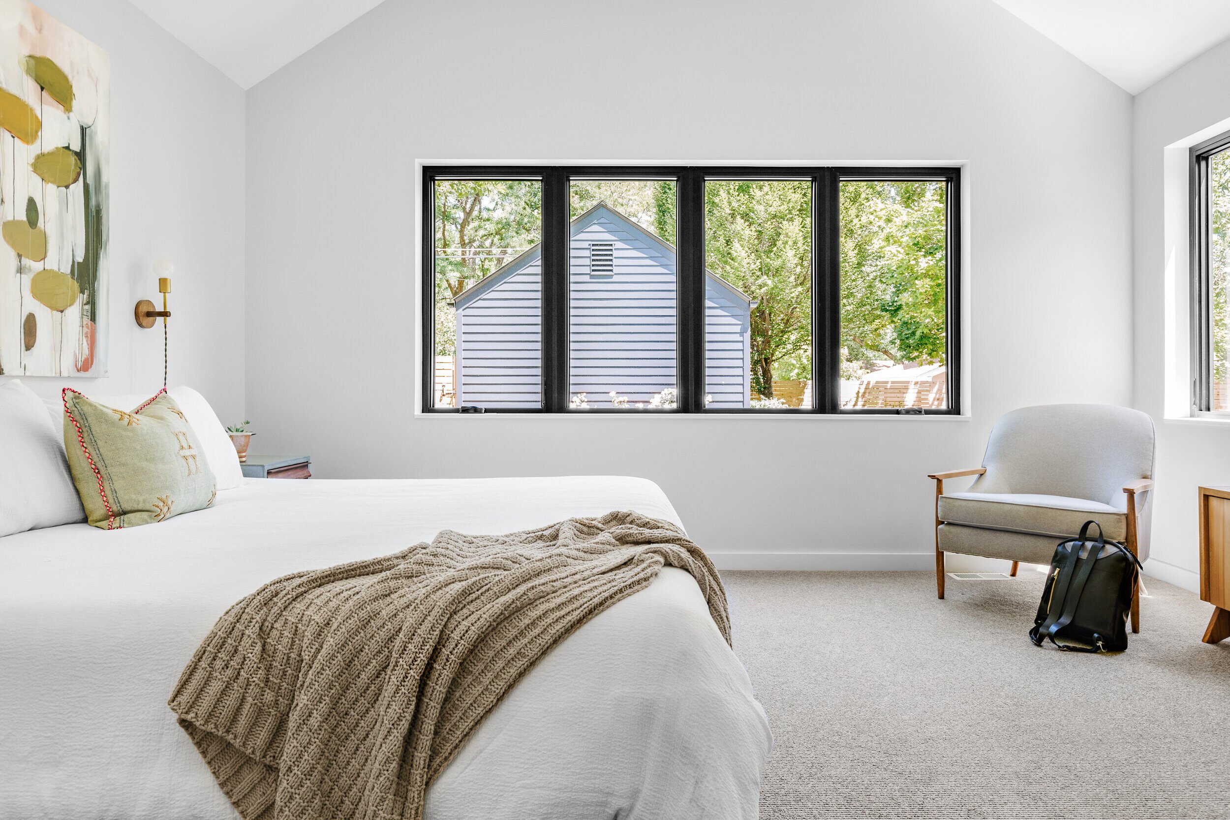 Open, airy, white bedroom design