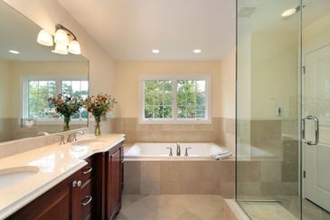 bathroom remodel idea for cape cod with dark wood vanity and bath under window