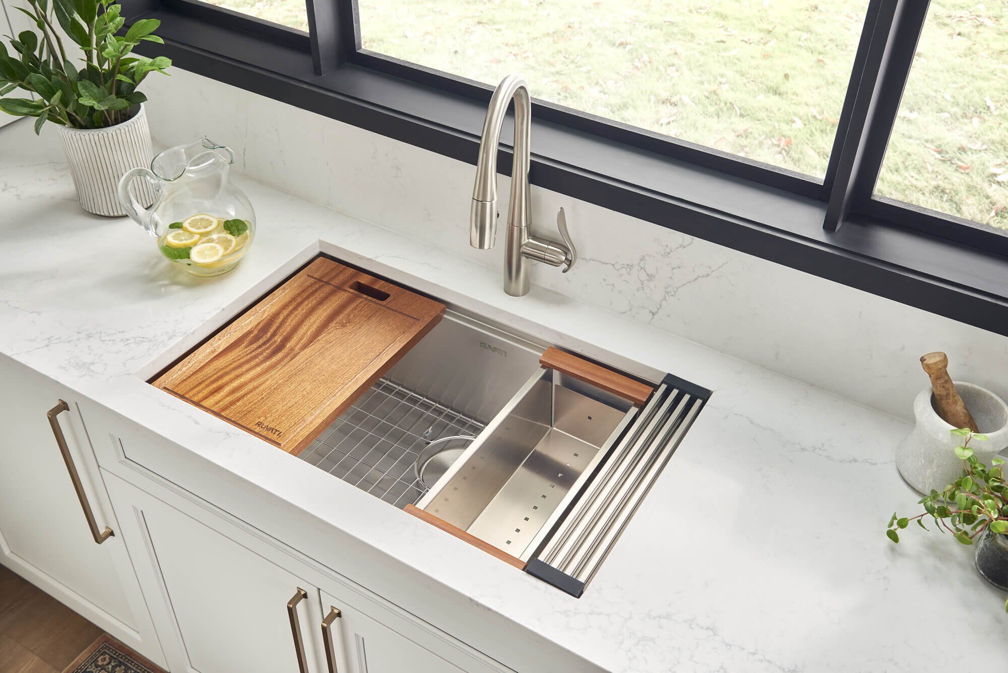 Ruvati Roma sink features mahogany cutting board and foldable drying rack