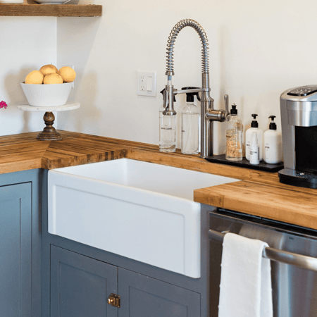 Farmhouse style kitchen with butcher block countertop