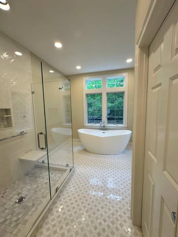 bathroom remodeled with bath tub and walk in shower in new seabury