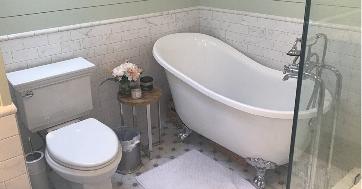 completed bathroom remodel with large tub