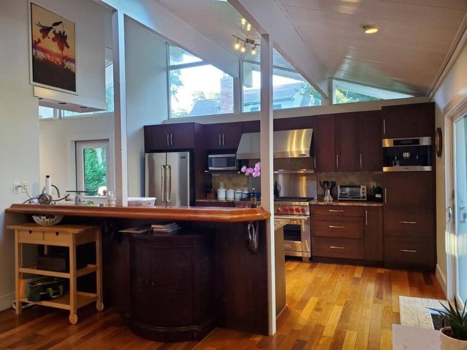 cape_cod_kitchen_before_remodel_dark-cupboards