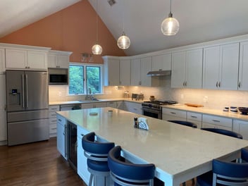 remodeled kitchen with vaulted ceiling in a cape cod home